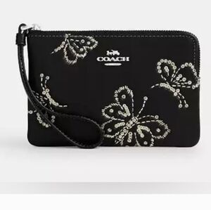 Coach Corner Zip Wristlet w/ Sparkly Butterfly Print. 6.25"x4.0"x0.5"